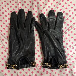 Black leather gloves with gold chain detail